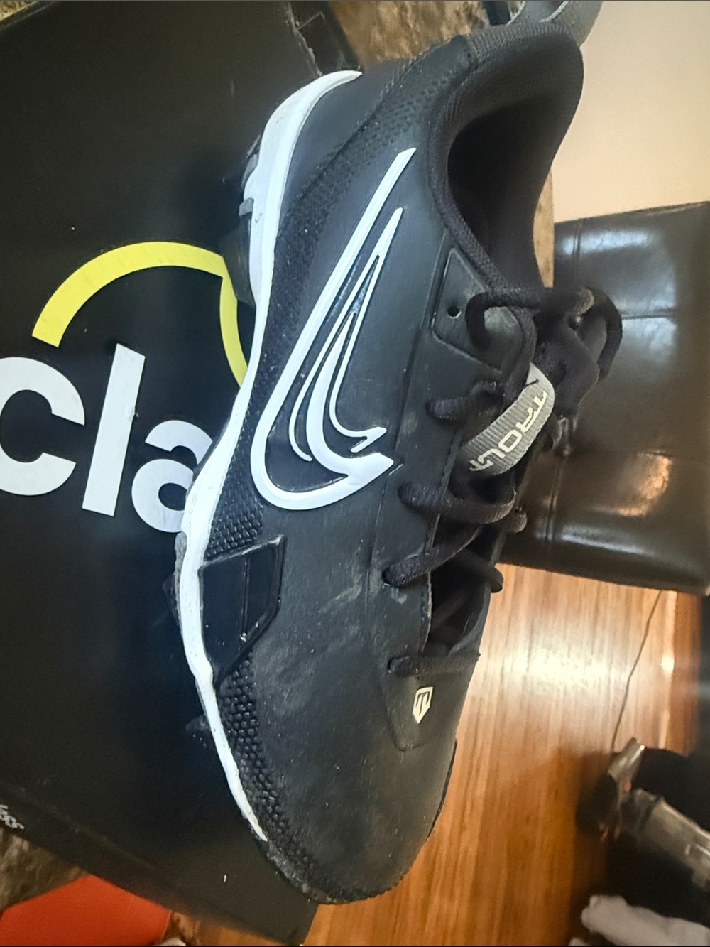 Nike Kids Black Cleats with White Swoosh